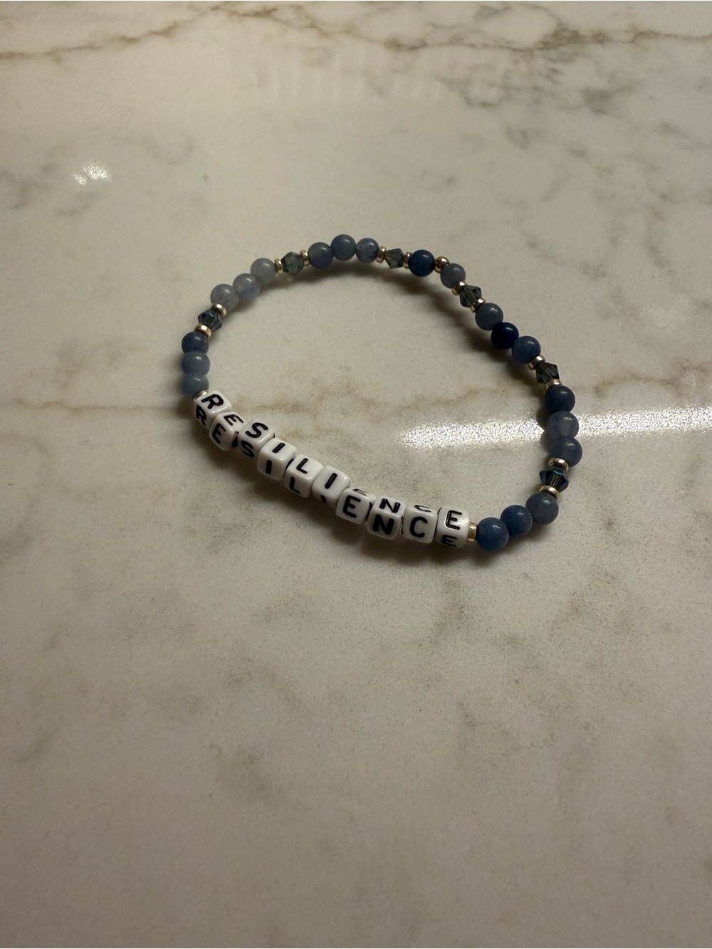 AMAZON - Resilience Blue Beaded Stretch Bracelet with White Letter Beads